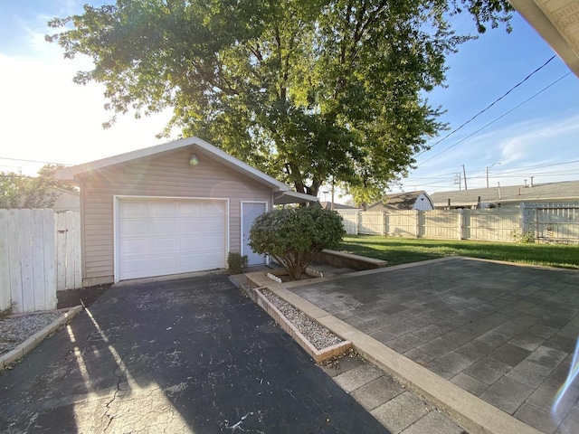 garage featuring a lawn