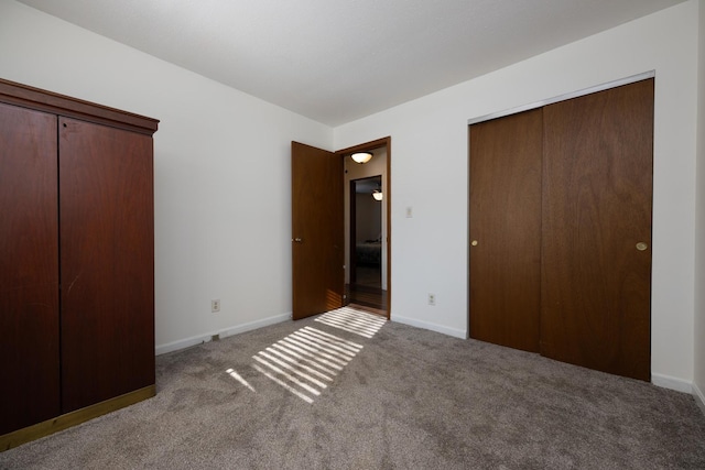 unfurnished bedroom with a closet and carpet