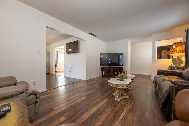 living room featuring dark hardwood / wood-style flooring