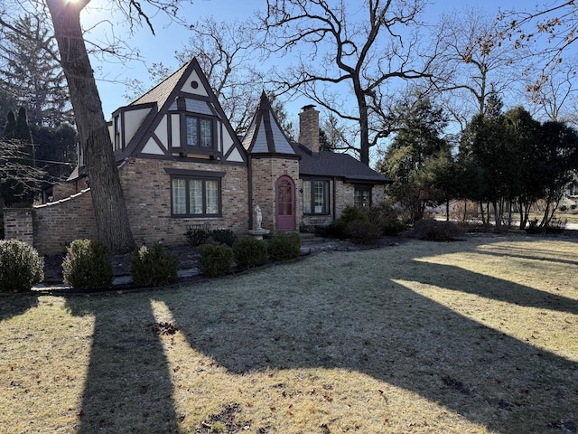 tudor home with a front yard