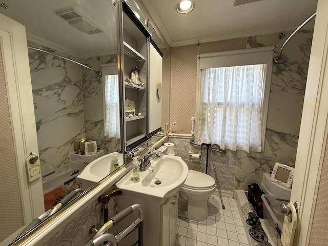 bathroom featuring toilet, ornamental molding, tile patterned floors, and vanity