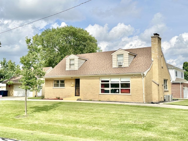 new england style home featuring central AC unit and a front yard