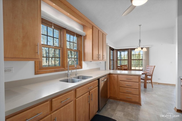 kitchen featuring dishwasher, sink, hanging light fixtures, kitchen peninsula, and plenty of natural light