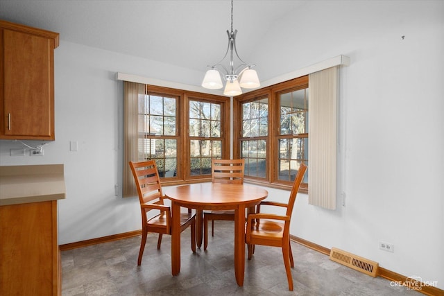 dining room with a notable chandelier