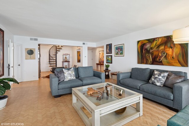 living room featuring light parquet flooring