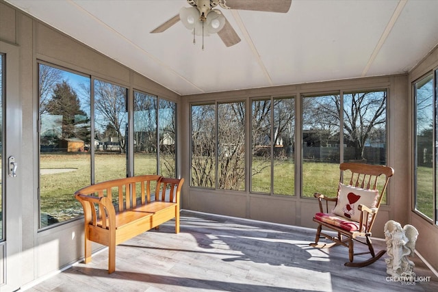 sunroom featuring ceiling fan