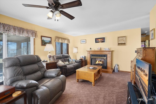 carpeted living room featuring ceiling fan