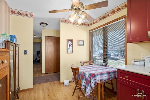 dining room featuring light wood-type flooring and ceiling fan