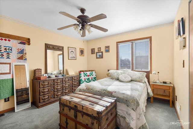 bedroom featuring ceiling fan, light colored carpet, and crown molding