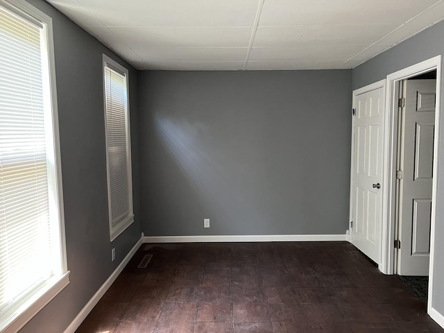 341 S Harrison Ave, Kankakee, IL 60901 - unfurnished bedroom with baseboards, wood finished floors, and visible vents