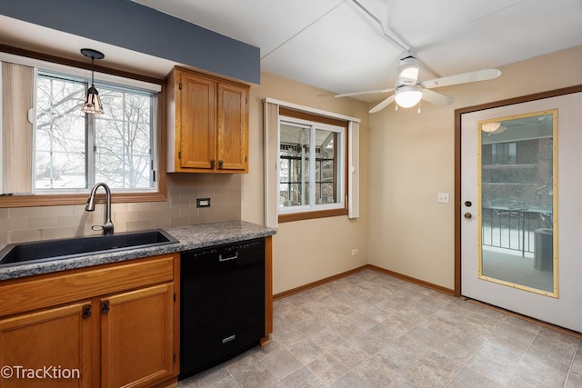 kitchen with dishwasher, pendant lighting, backsplash, ceiling fan, and sink