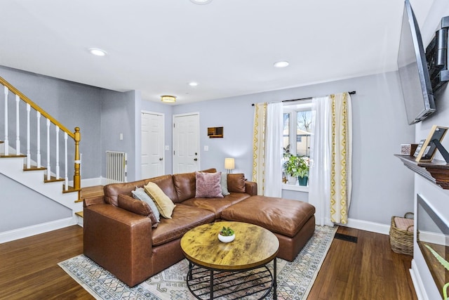 living room featuring dark hardwood / wood-style floors