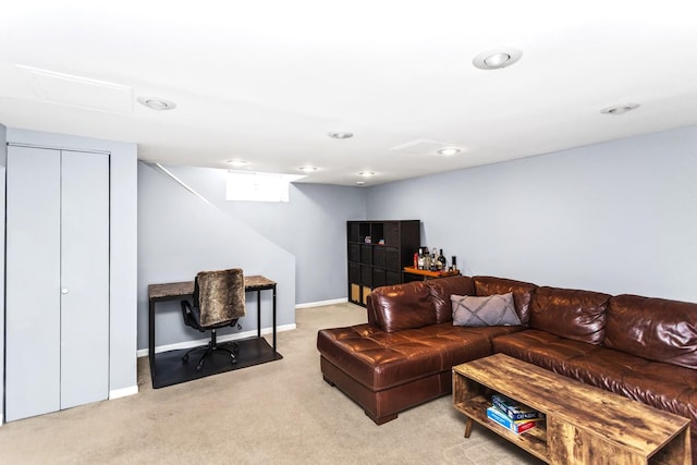 carpeted living room with a premium fireplace