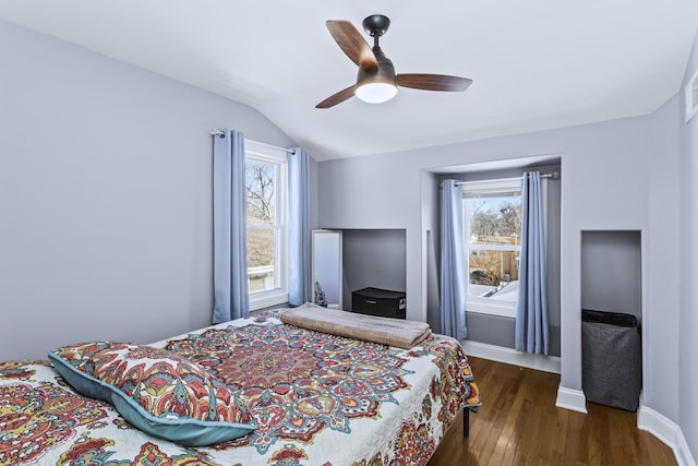 bedroom featuring ceiling fan and dark hardwood / wood-style floors