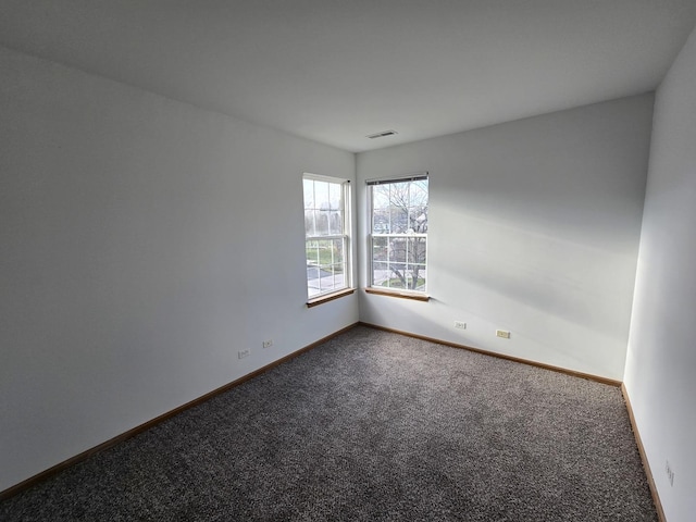 unfurnished room with carpet floors