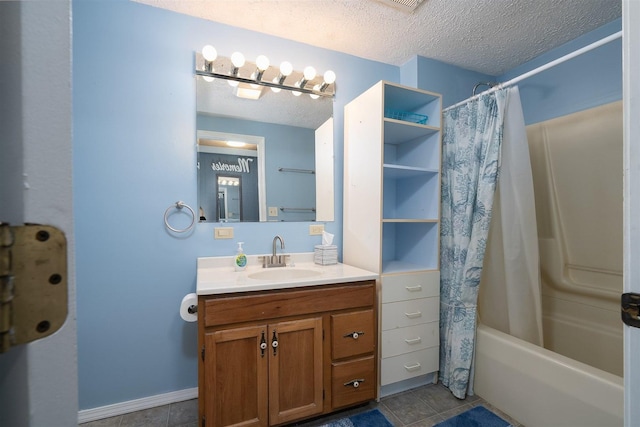 bathroom with tile patterned flooring, vanity, shower / bath combo, and a textured ceiling