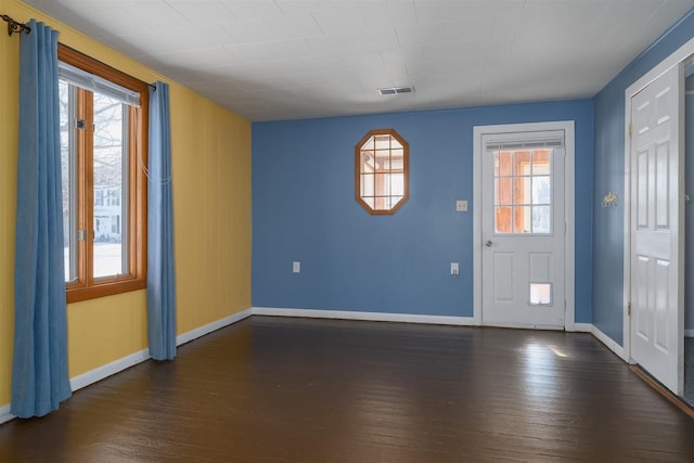 foyer entrance featuring dark hardwood / wood-style flooring