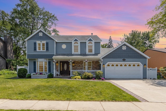 2921 Autumn Dr, Woodridge, IL 60517 - victorian home featuring an attached garage, concrete driveway, a front yard, covered porch, and a shingled roof