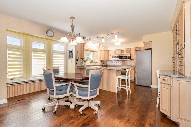 2921 Autumn Dr, Woodridge, IL 60517 - dining room featuring dark wood-style flooring and a chandelier