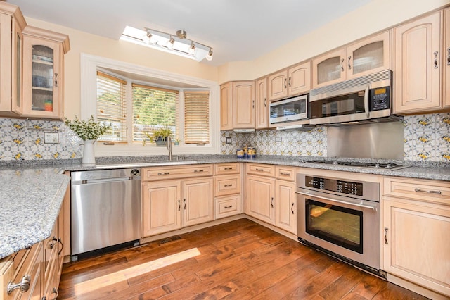 2921 Autumn Dr, Woodridge, IL 60517 - kitchen featuring appliances with stainless steel finishes, light brown cabinets, dark wood-style floors, and tasteful backsplash