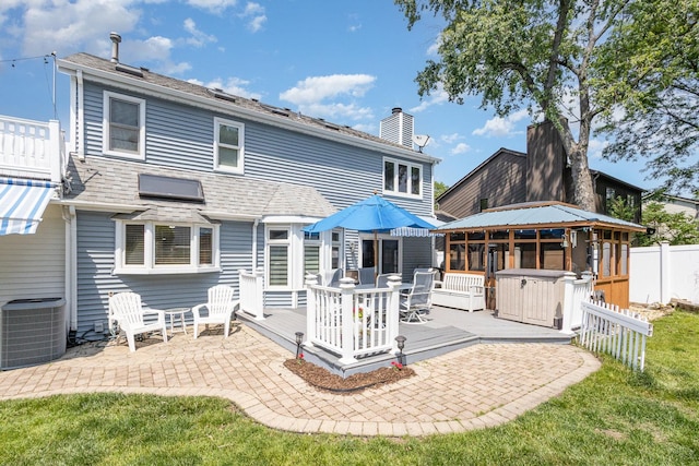 2921 Autumn Dr, Woodridge, IL 60517 - rear view of house featuring a chimney, outdoor dining area, a deck, a gazebo, and a patio