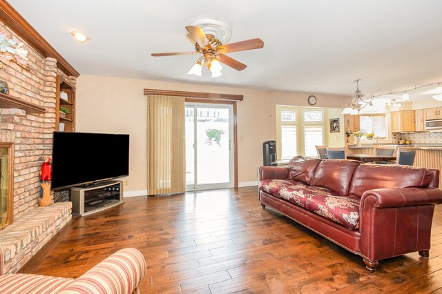 2921 Autumn Dr, Woodridge, IL 60517 - living room with healthy amount of natural light, dark wood-type flooring, ceiling fan, and a fireplace