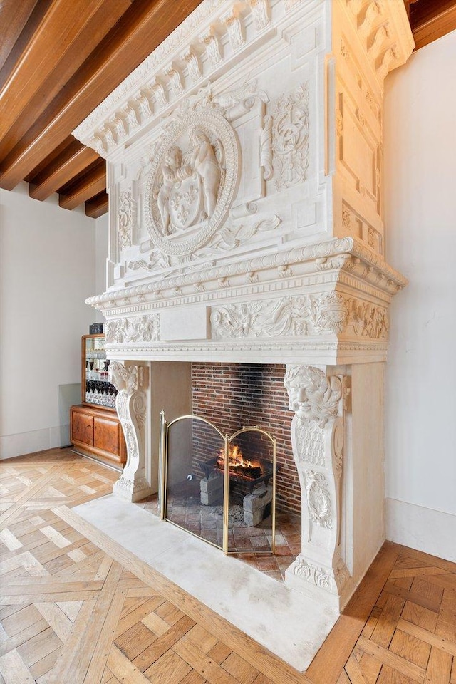 room details featuring parquet floors and a brick fireplace