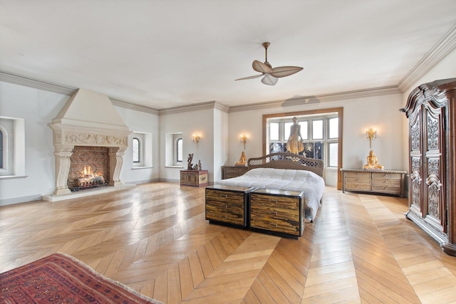 bedroom with a high end fireplace, light parquet floors, ceiling fan, and crown molding