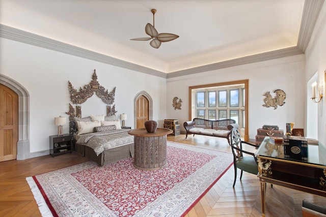 bedroom featuring light parquet floors, ceiling fan, and crown molding