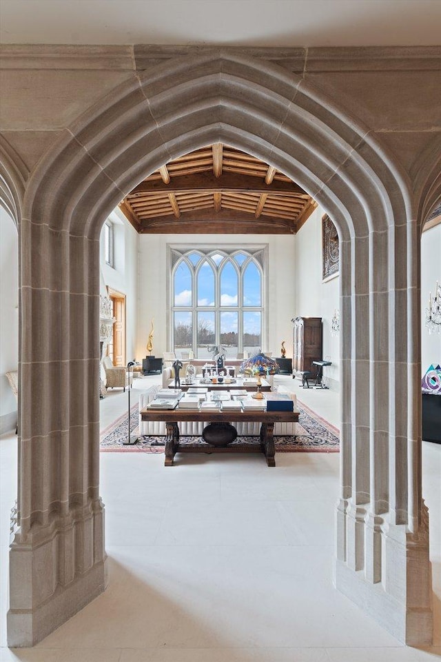 interior space featuring beamed ceiling and wood ceiling