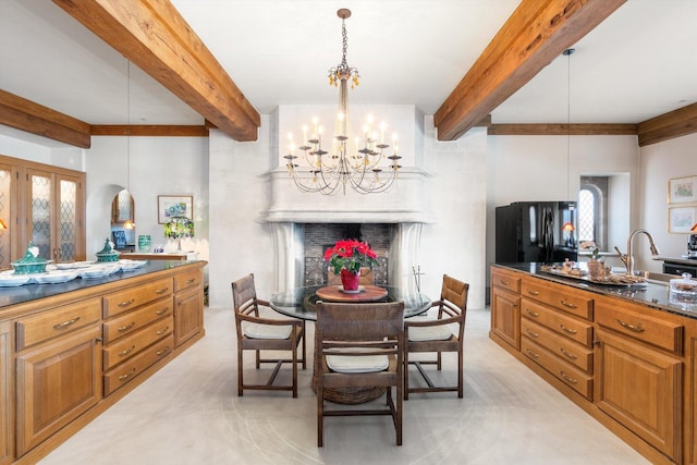 dining room with beamed ceiling, sink, and a chandelier