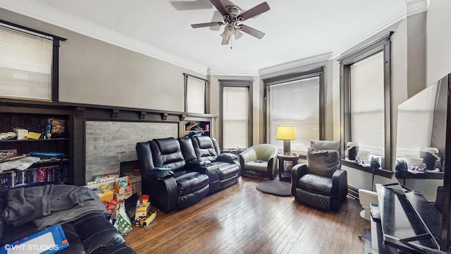 living room featuring hardwood / wood-style flooring, ceiling fan, and crown molding