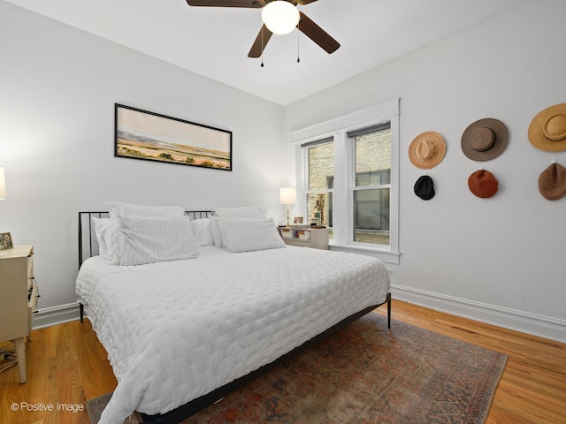 bedroom featuring hardwood / wood-style floors and ceiling fan