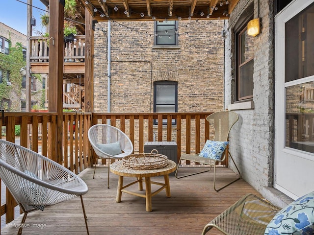 wooden deck featuring central AC unit