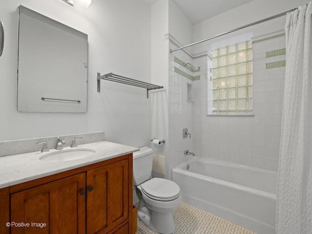 full bathroom featuring vanity, toilet, tile patterned flooring, and shower / bath combo with shower curtain