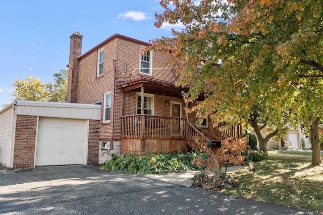 view of front of property with a porch and a garage