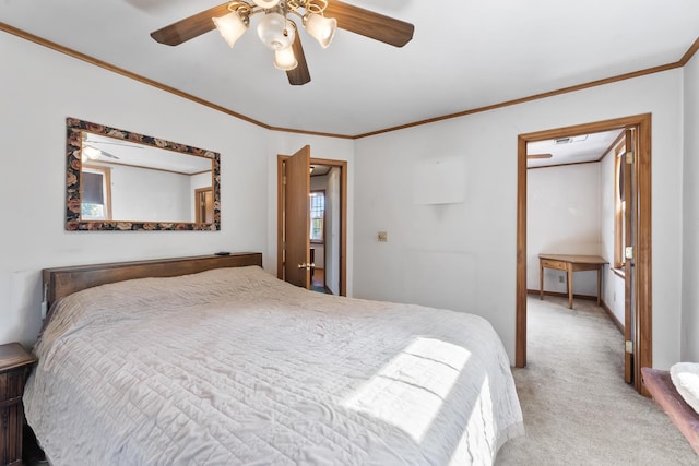 carpeted bedroom featuring ceiling fan and crown molding