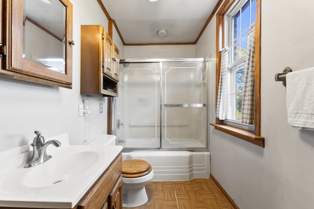 full bathroom with vanity, bath / shower combo with glass door, toilet, parquet flooring, and ornamental molding