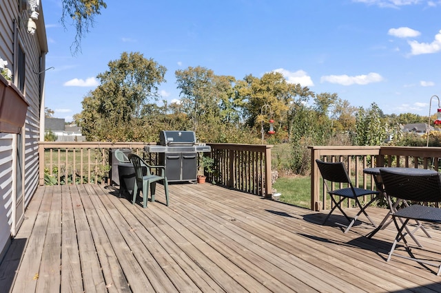 deck featuring a grill