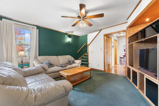 living room with carpet flooring, ceiling fan, and crown molding