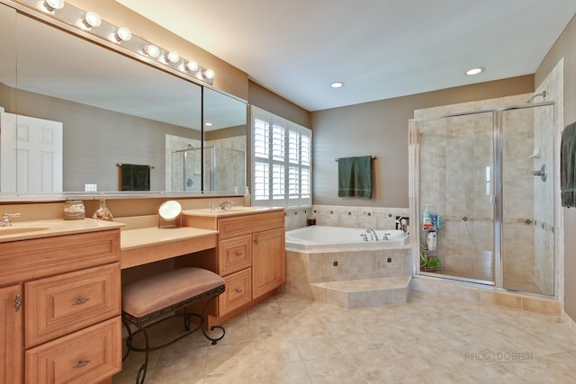 bathroom with tile patterned floors, vanity, and independent shower and bath