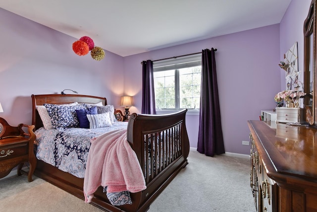 bedroom featuring light colored carpet