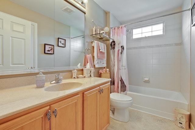 full bathroom featuring tile patterned floors, vanity, shower / bath combination with curtain, and toilet