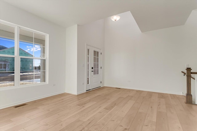 spare room with light hardwood / wood-style flooring