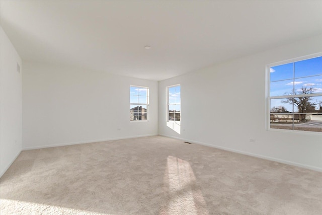 empty room featuring light carpet