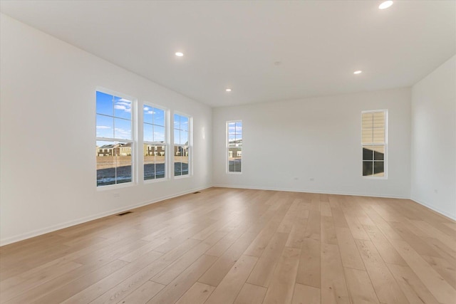 unfurnished room featuring light hardwood / wood-style floors