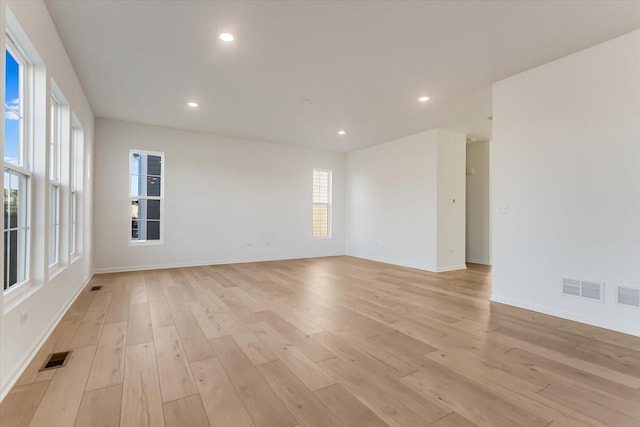 spare room with light hardwood / wood-style floors