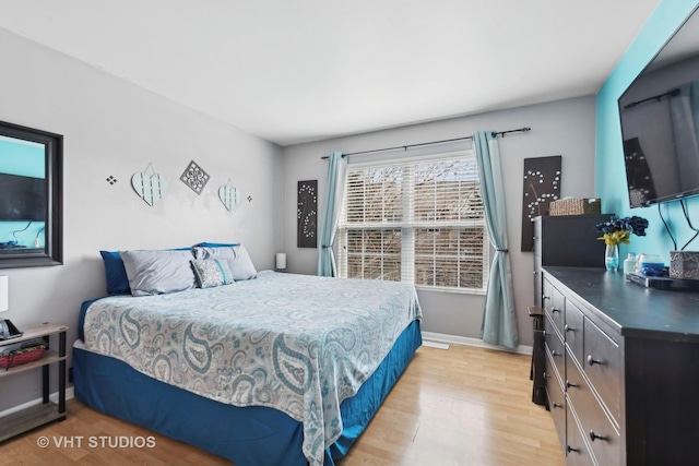 bedroom with light wood-type flooring