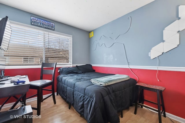 bedroom with light wood-type flooring