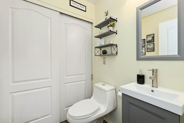 bathroom with vanity and toilet